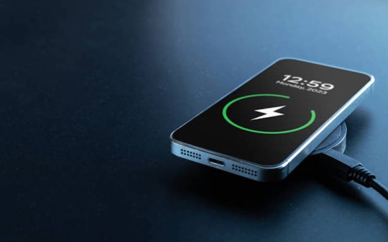 Phone charge. Mobile cell phone charge battery from wireless smart charger. Modern technology, portable fast charger